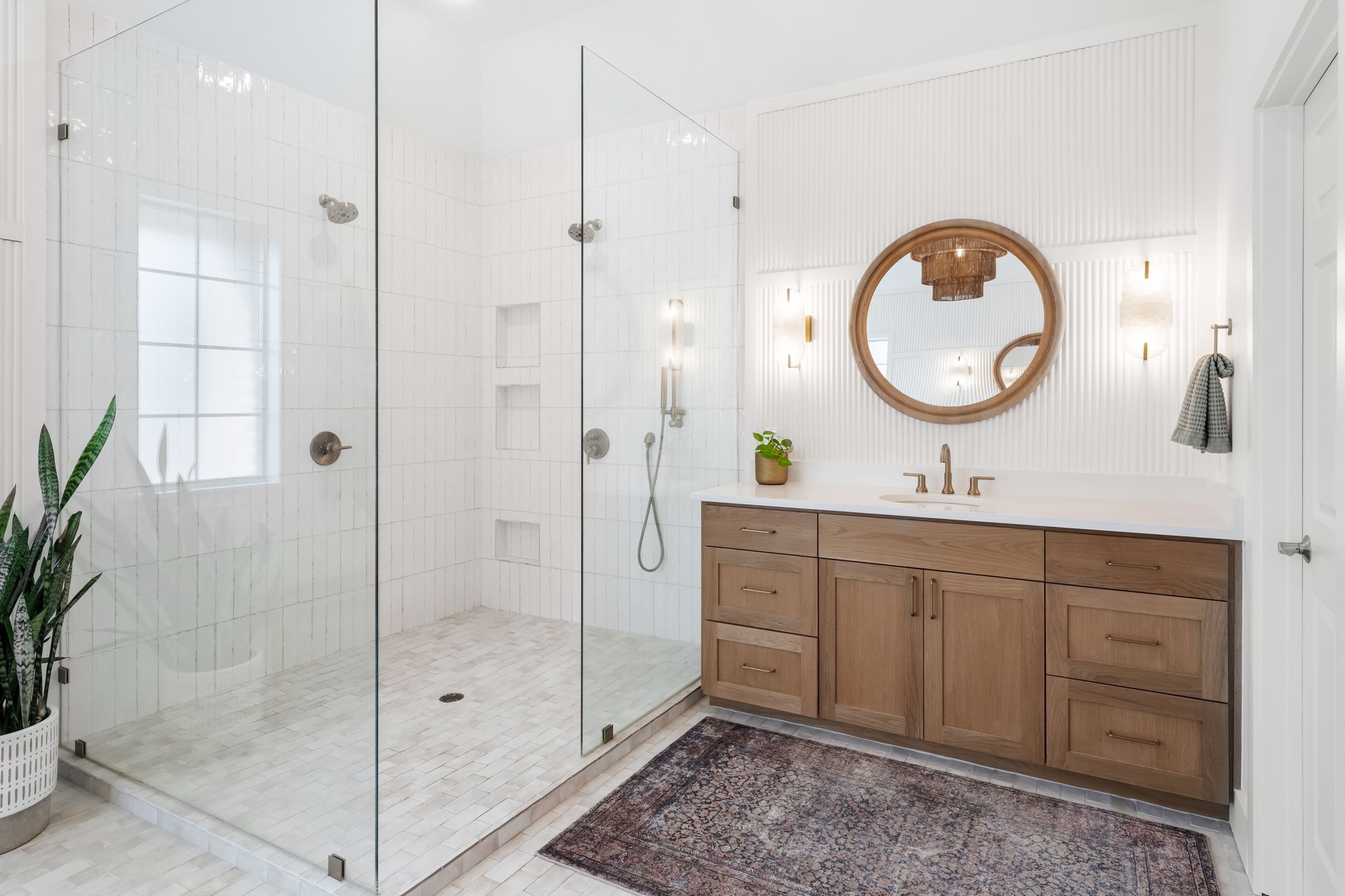 13612 Flat Top Ranch Road Austin, TX 78732 - Photo 21 of 40 a bathroom with a double vanity sink and a mirror