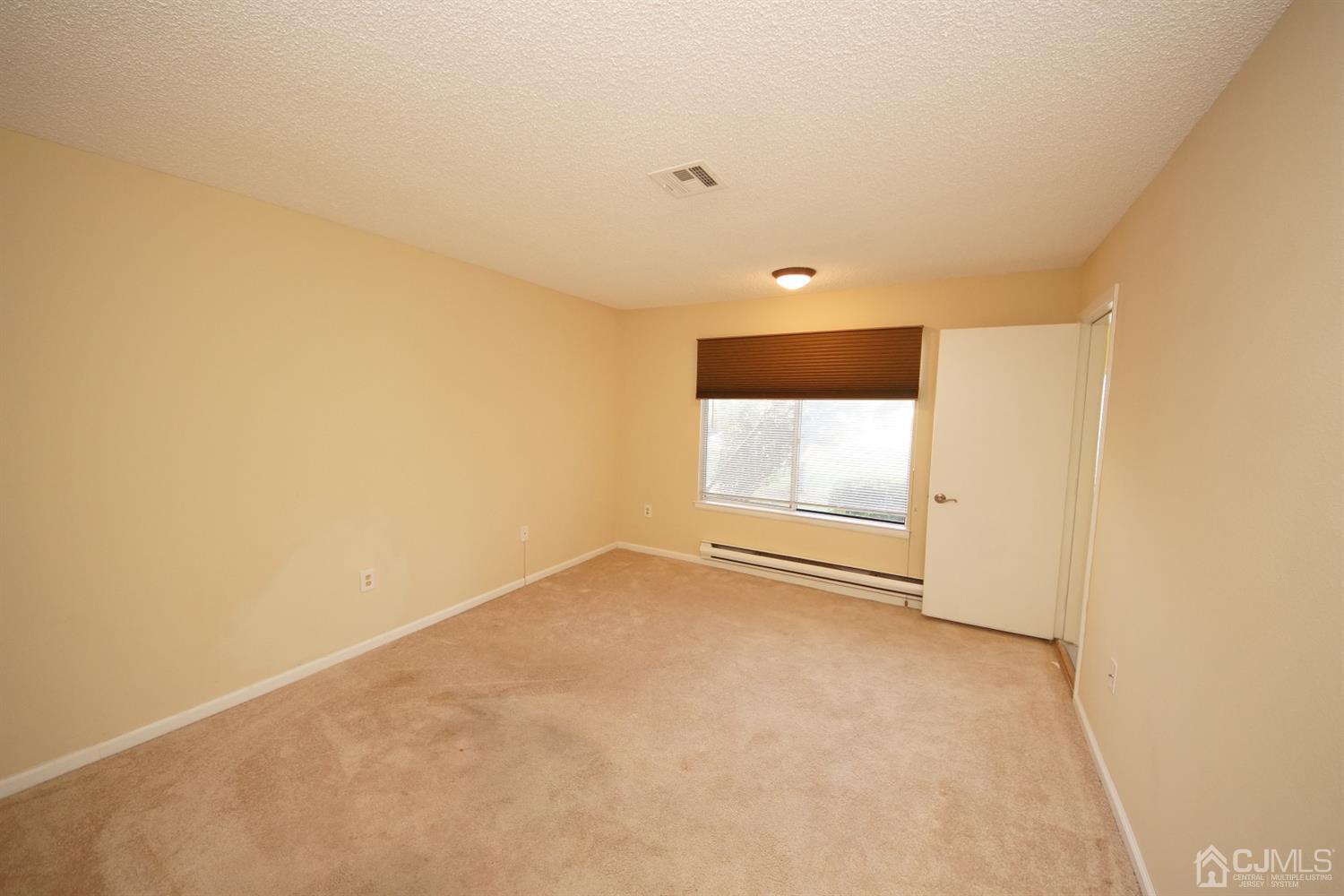 800B Pompton Road, Unit 800D Monroe Township, NJ 08831 - Photo 17 of 28 a view of an empty room with a window