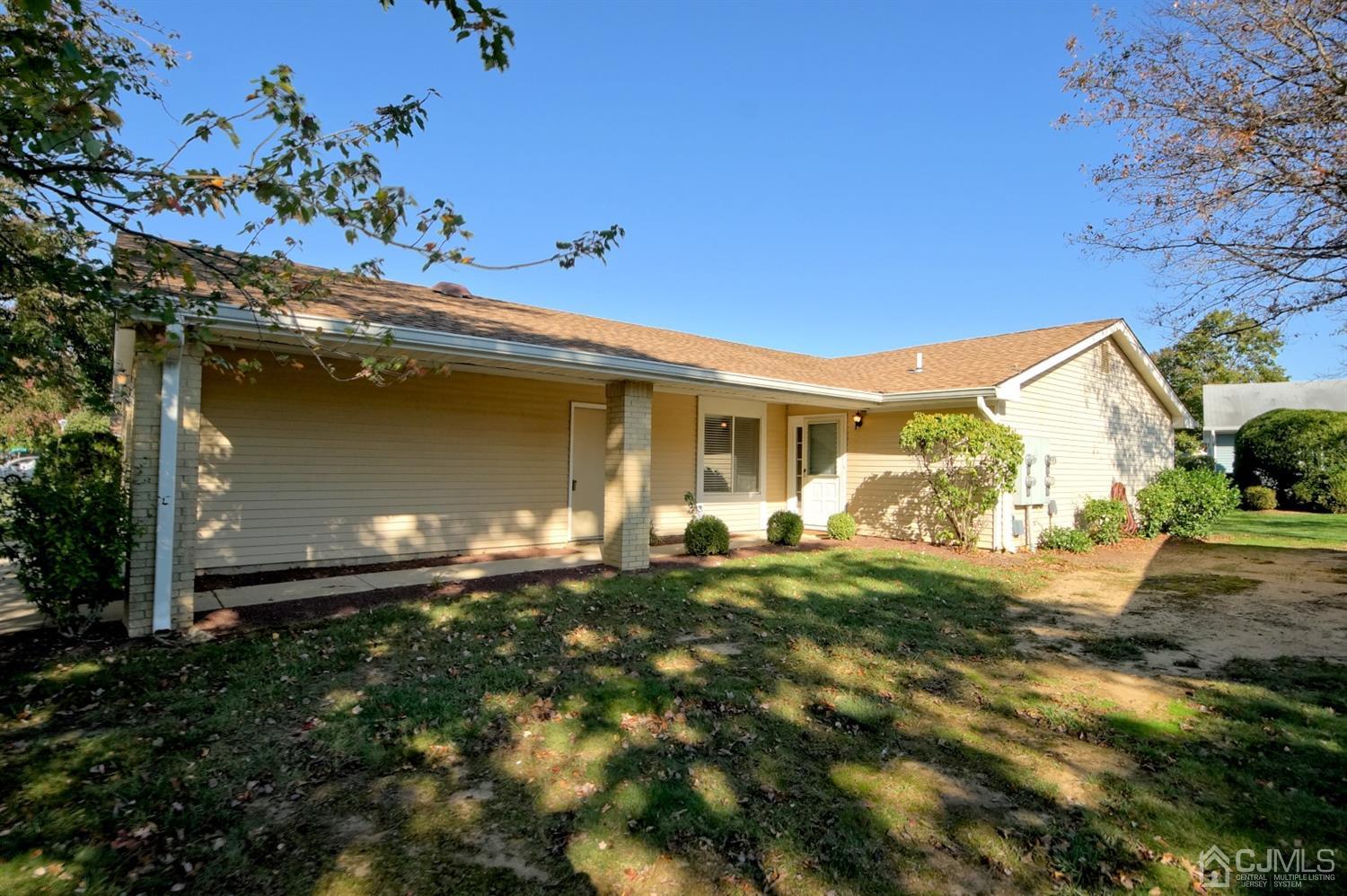 800B Pompton Road, Unit 800D Monroe Township, NJ 08831 - Photo 3 of 28 a front view of a house with garden