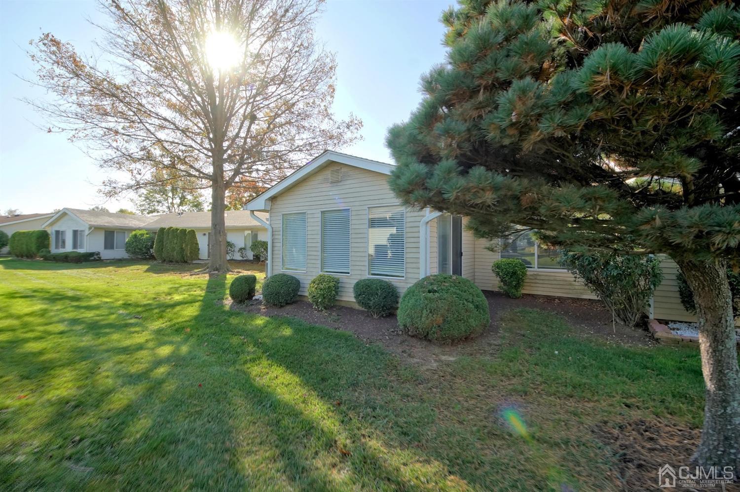 800B Pompton Road, Unit 800D Monroe Township, NJ 08831 - Photo 28 of 28 a view of a house with backyard sitting area and garden
