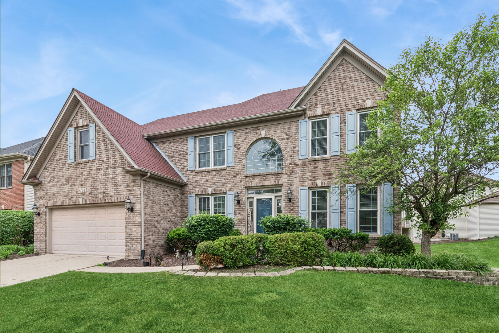 3744 Highknob Circle Naperville, IL 60564 - Photo 1 of 20 a front view of a house with a yard and garage
