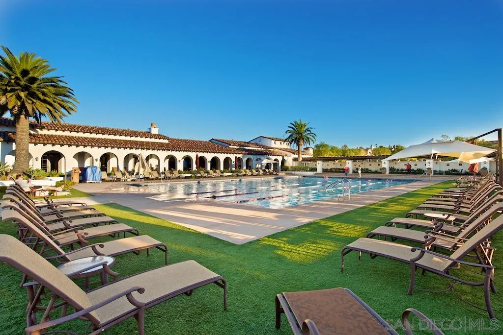 5536 Rabbit Ridge Road San Diego, CA 92130 - Photo 15 of 19 a view of a swimming pool with lawn chairs and plants