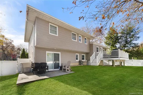 a view of a house with a yard porch and sitting area