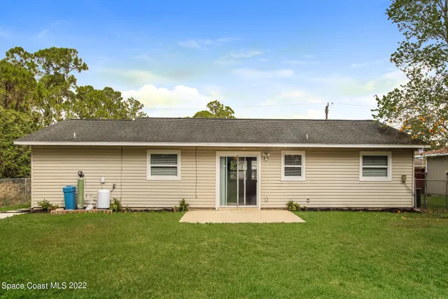 a bathroom with a sink toilet and mirror