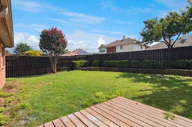 a view of a backyard with a garden