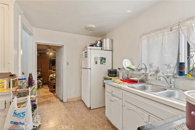 a kitchen with a sink and cabinets