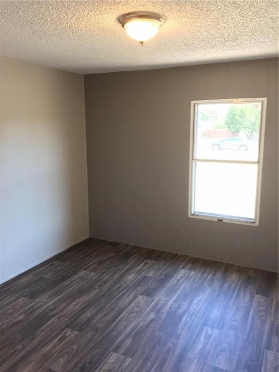 365 Darrell Road Roanoke, TX 76262 - Photo 16 of 22 Wood-finish flooring with varying tones, neutral wall finishes, and a flush-mount ceiling light fixture