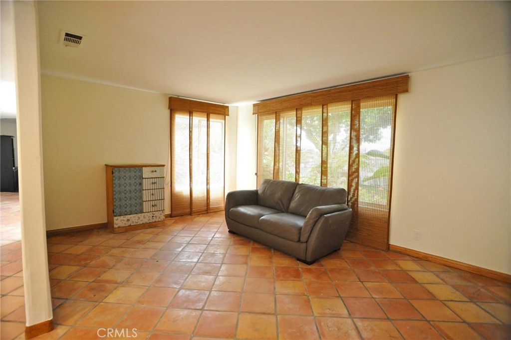 1707 Hygeia Avenue Encinitas, CA 92024 - Photo 22 of 41 a living room with furniture and a flat screen tv