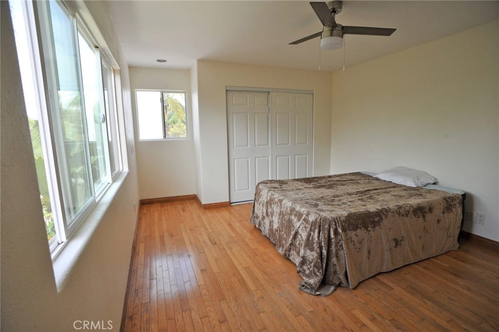 1707 Hygeia Avenue Encinitas, CA 92024 - Photo 24 of 41 a spacious bedroom with a bed and wooden floor