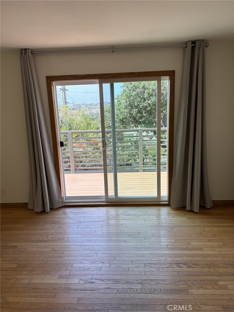 1707 Hygeia Avenue Encinitas, CA 92024 - Photo 41 of 41 a view of empty room with wooden floor and fan