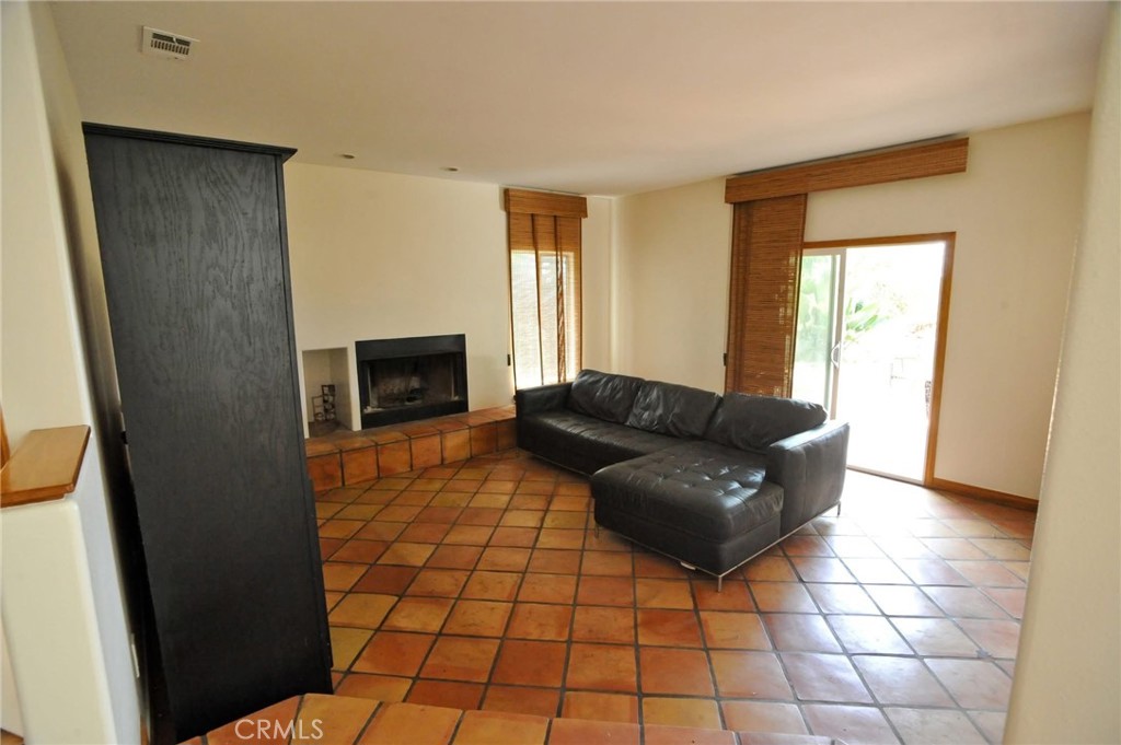 1707 Hygeia Avenue Encinitas, CA 92024 - Photo 9 of 41 a living room with a couch and a fireplace