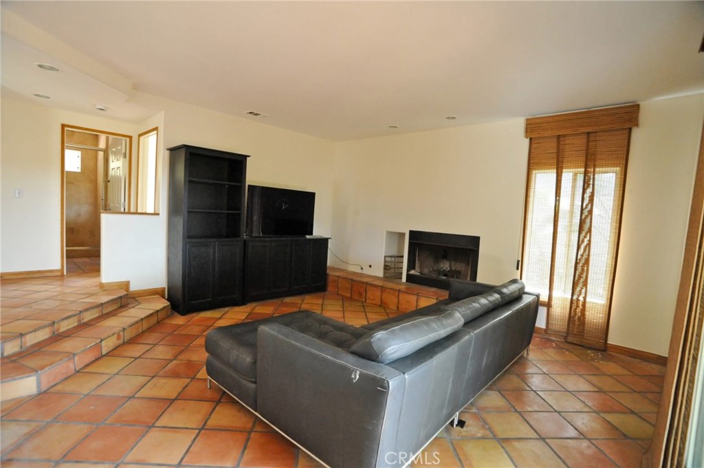 1707 Hygeia Avenue Encinitas, CA 92024 - Photo 10 of 41 a living room with stainless steel appliances furniture a rug and a window