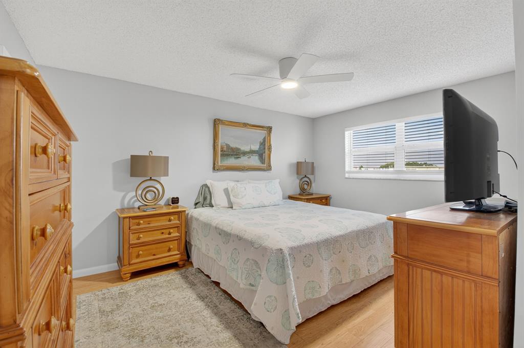 2601 Northeast 3rd Street, Unit 403 Boynton Beach, FL 33435 - Photo 12 of 33 a bedroom with a bed and a flat screen tv