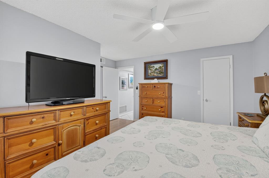 2601 Northeast 3rd Street, Unit 403 Boynton Beach, FL 33435 - Photo 13 of 33 a bedroom with a bed and a flat screen tv in it