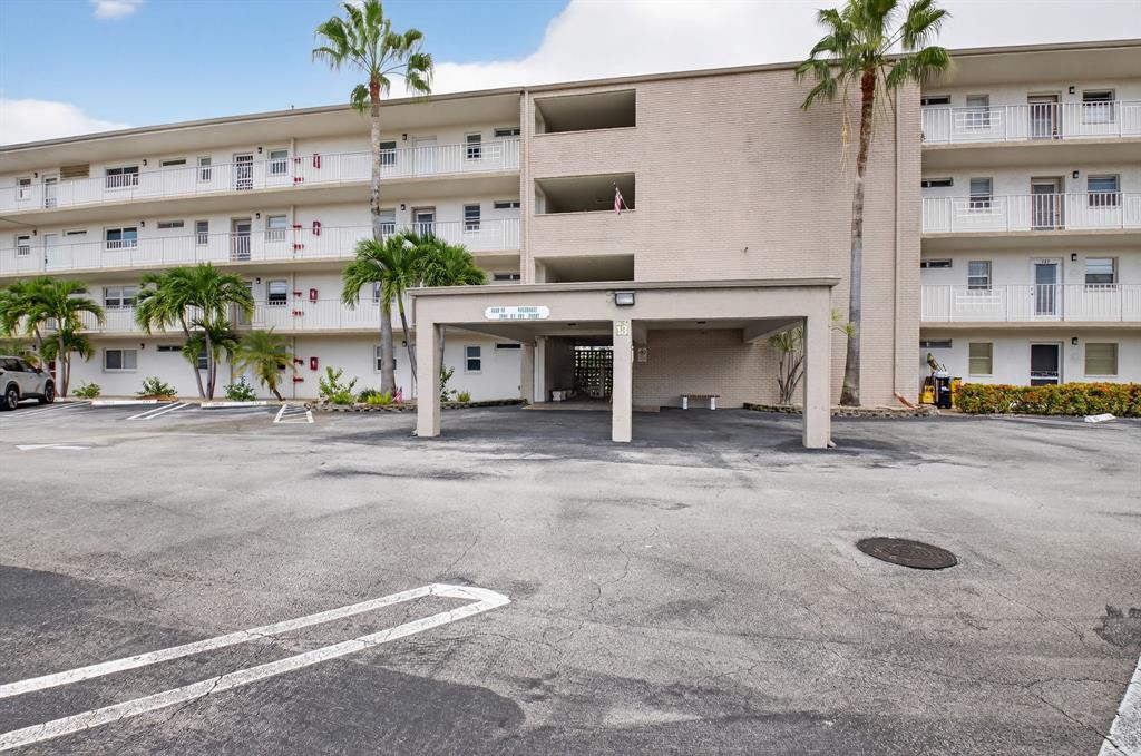 2601 Northeast 3rd Street, Unit 403 Boynton Beach, FL 33435 - Photo 21 of 33 front view of a building with a street