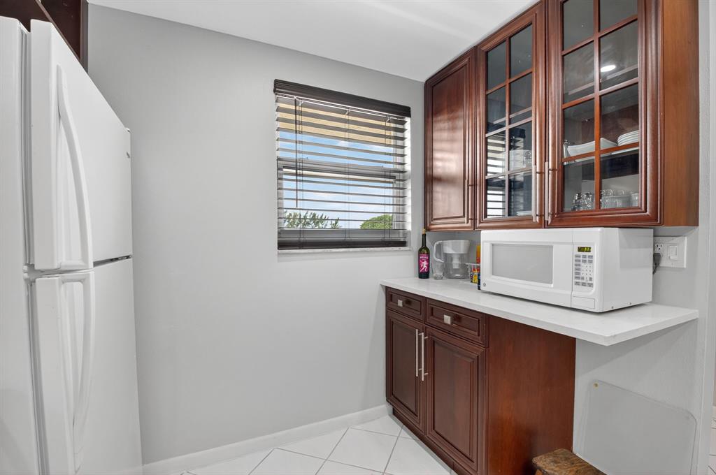 2601 Northeast 3rd Street, Unit 403 Boynton Beach, FL 33435 - Photo 8 of 33 a kitchen with a sink and a window