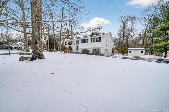 a view of a house with a snow in front of house
