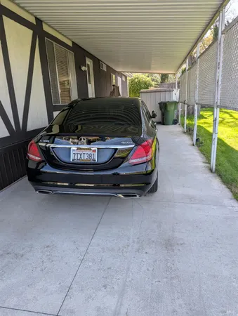 a view of a wooden deck and a yard