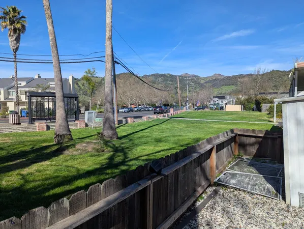 a view of a house with sitting area and swimming pool