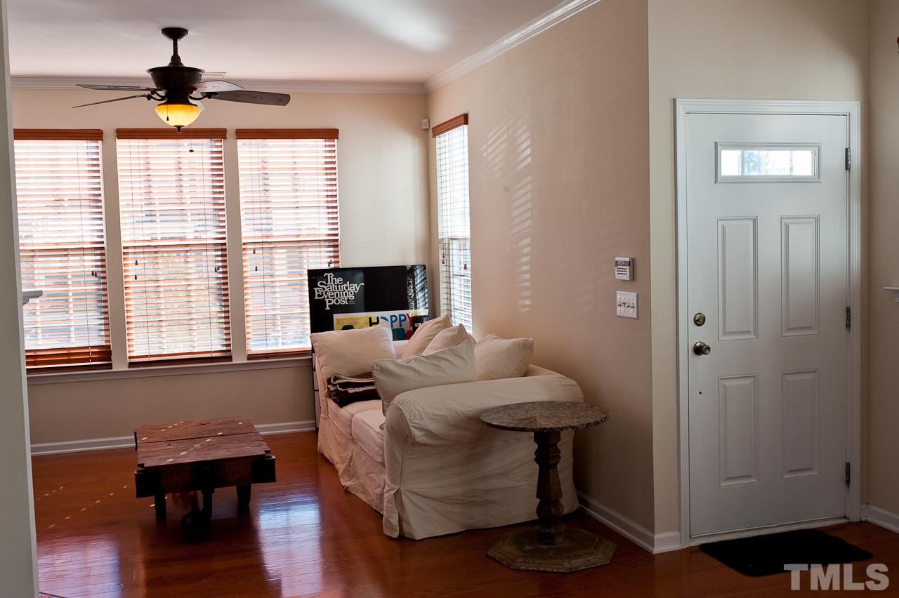 7874 Spungold Street Raleigh, NC 27617 - Photo 2 of 18 a living room with furniture and a window