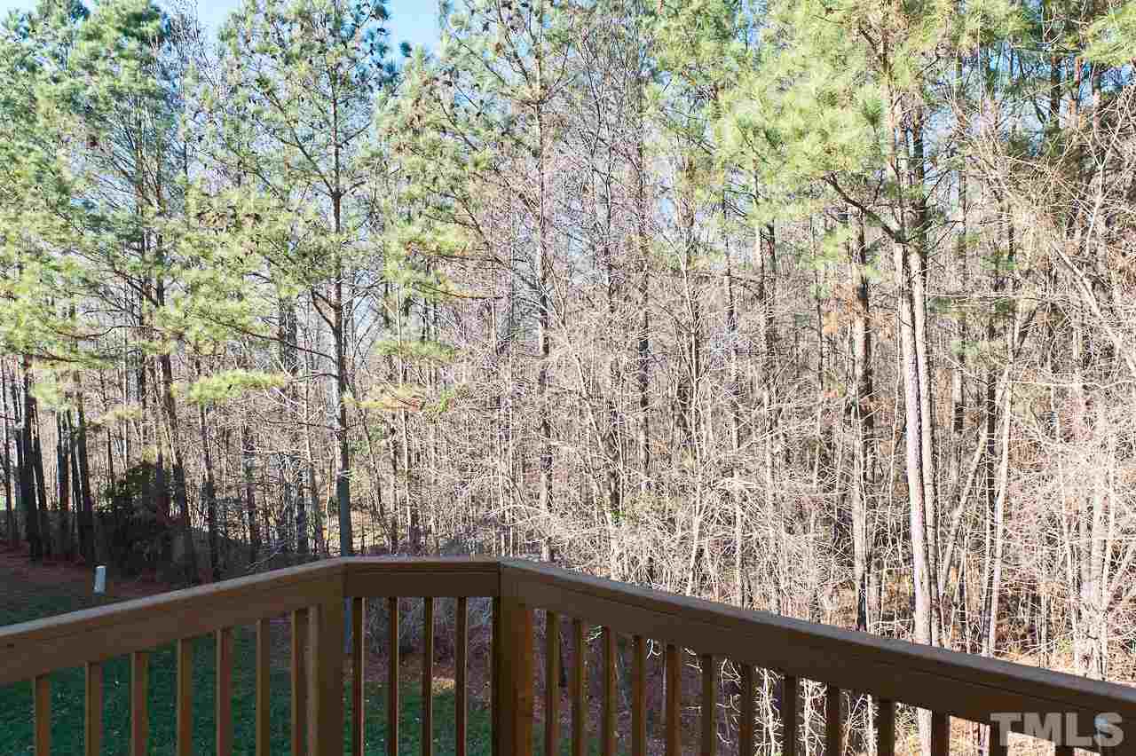 7874 Spungold Street Raleigh, NC 27617 - Photo 17 of 18 a view of a balcony with wooden fence