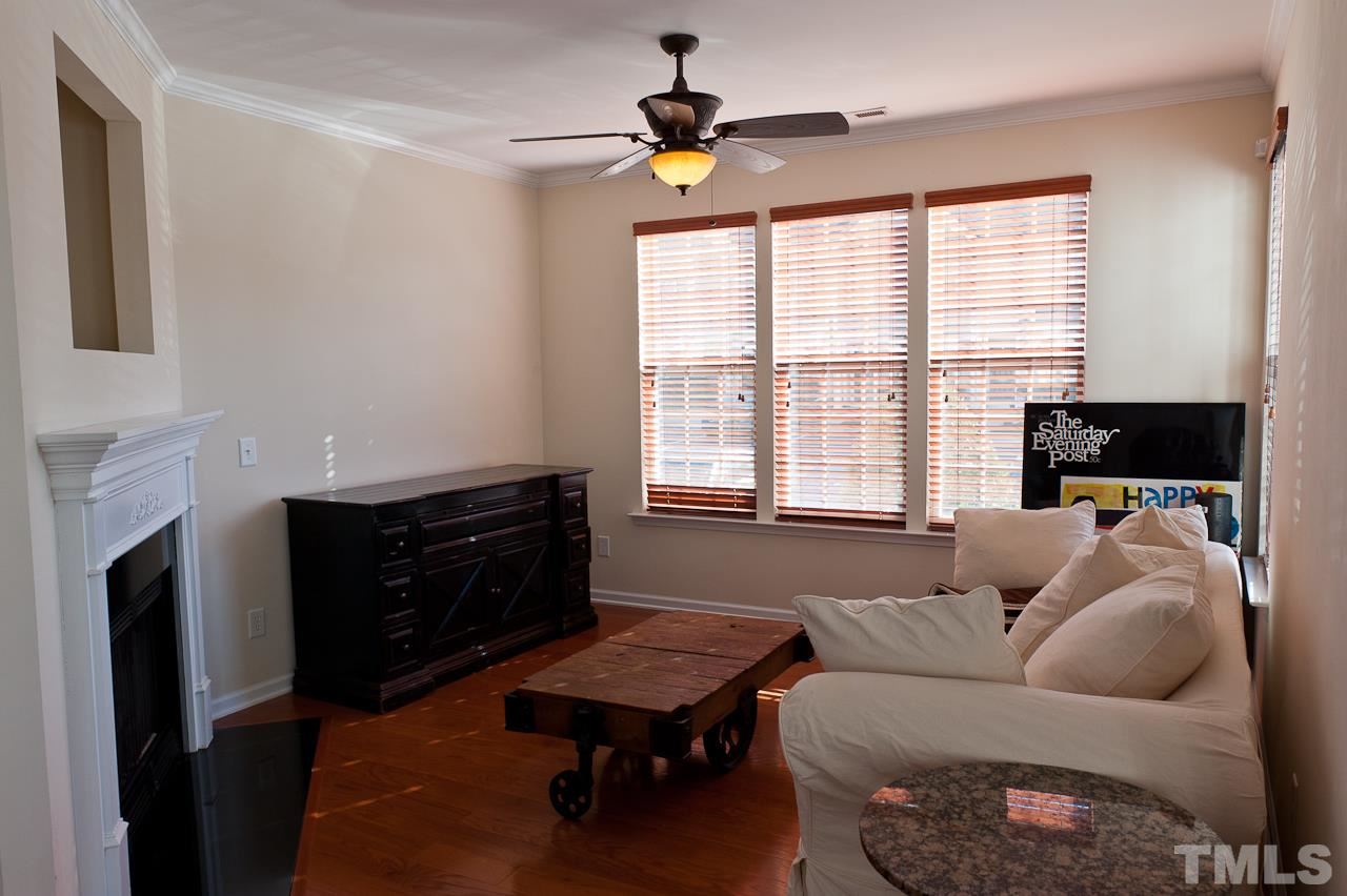7874 Spungold Street Raleigh, NC 27617 - Photo 3 of 18 a living room with furniture and a window
