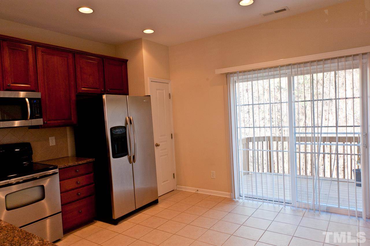 7874 Spungold Street Raleigh, NC 27617 - Photo 10 of 18 a view of a kitchen with electric appliances
