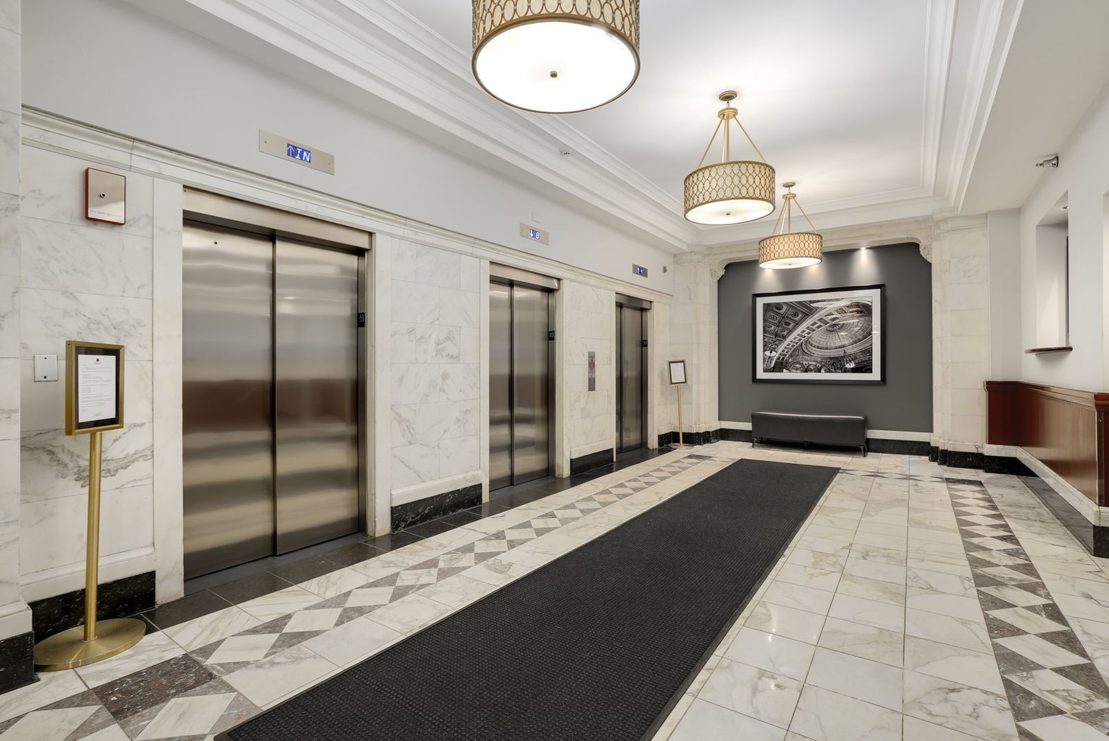 40 East 9th Street, Unit 716 Chicago, IL 60605 - Photo 33 of 37 a view of a hallway with wooden floor and chandelier