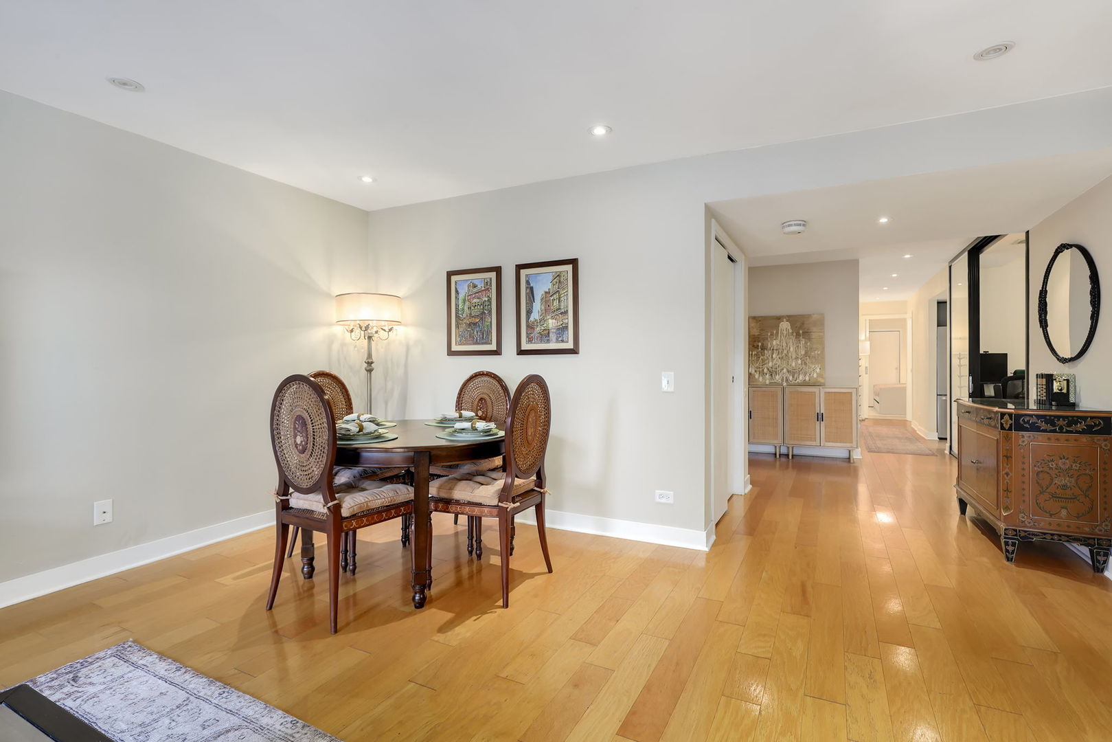 40 East 9th Street, Unit 716 Chicago, IL 60605 - Photo 5 of 37 a view of a dining room with furniture and wooden floor