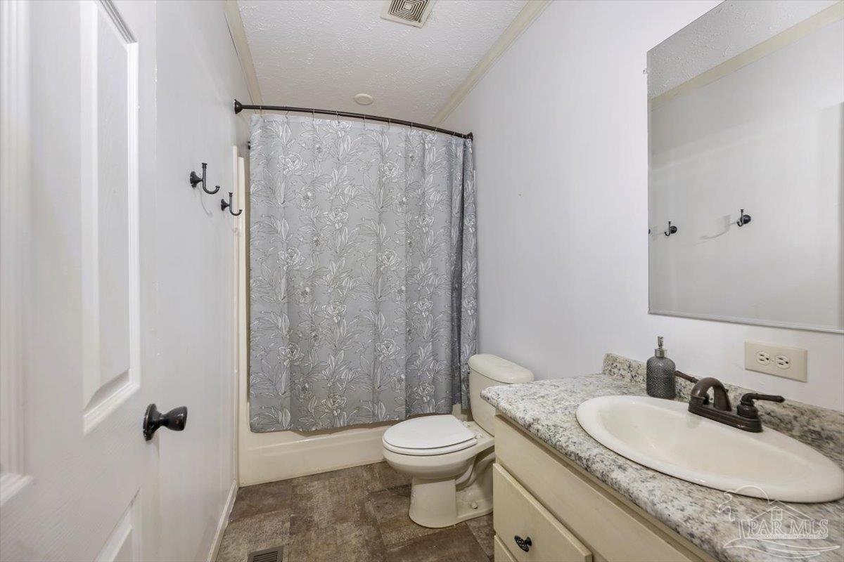 8762 Bailly Road Milton, FL 32583 - Photo 28 of 35 Full Bath to be shared by 2nd and 3rd bedrooms.