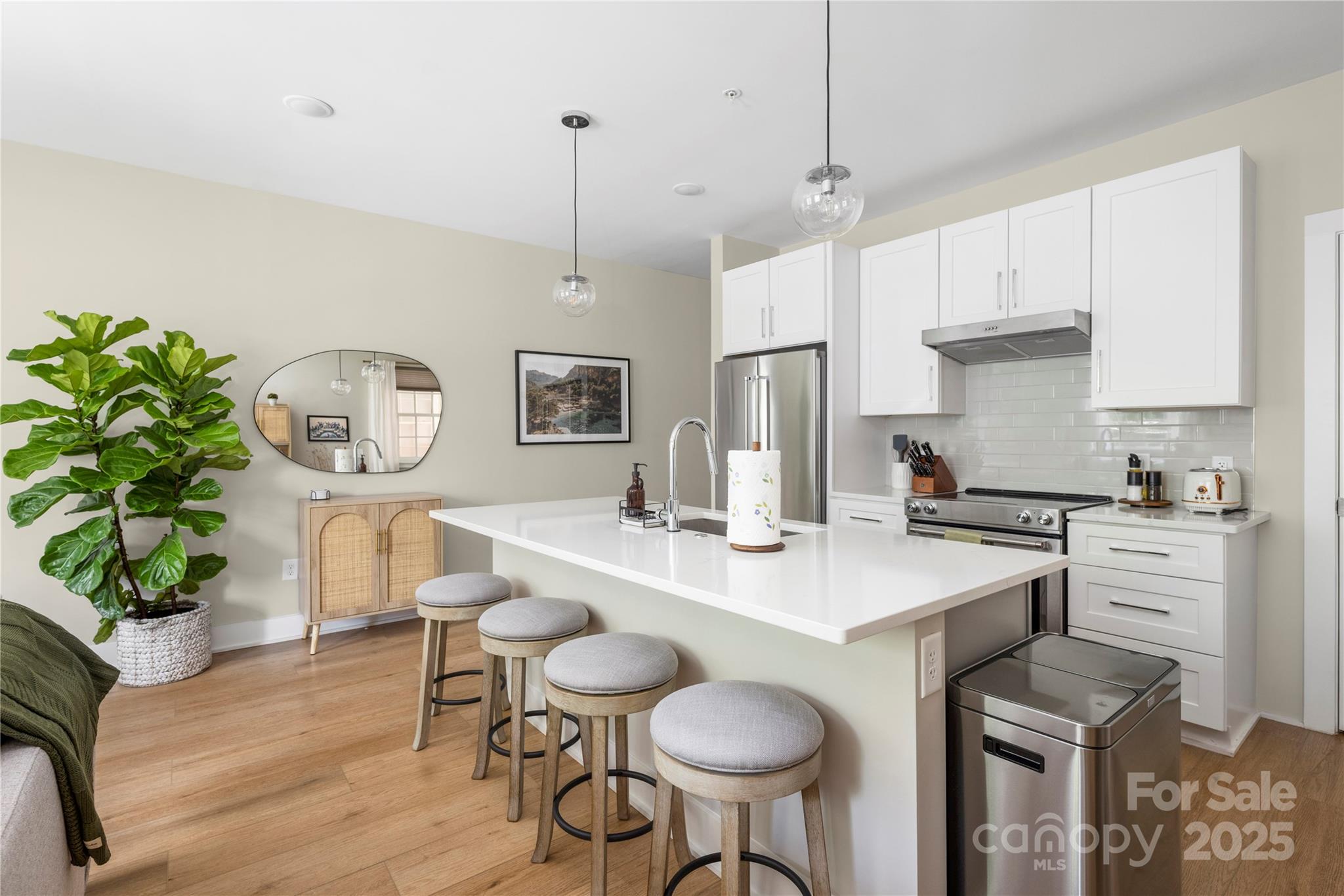 a kitchen with a table and chairs in it