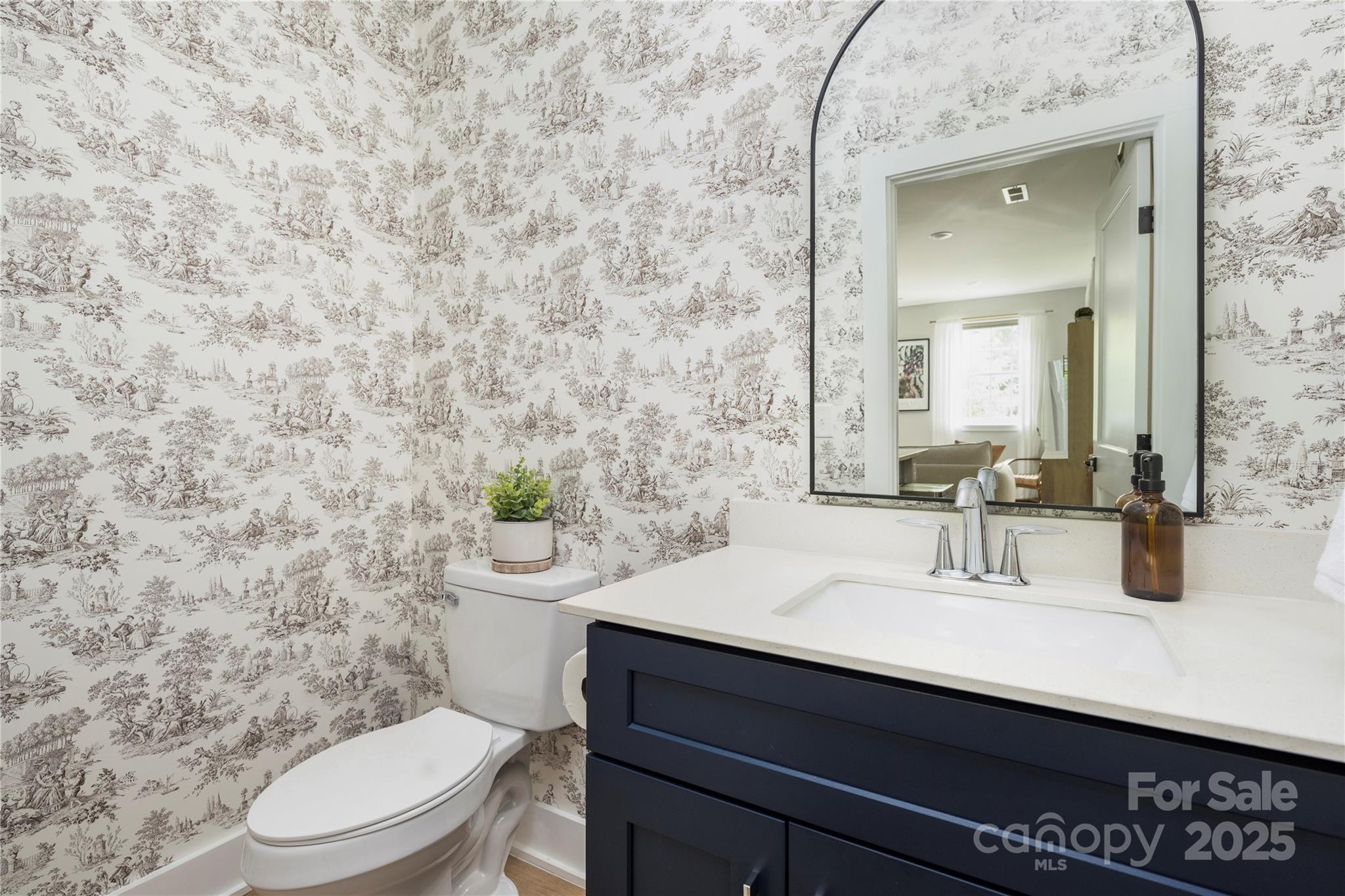 203 Grandin Road, Unit 3 Charlotte, NC 28208 - Photo 14 of 34 a bathroom with a sink a toilet and mirror