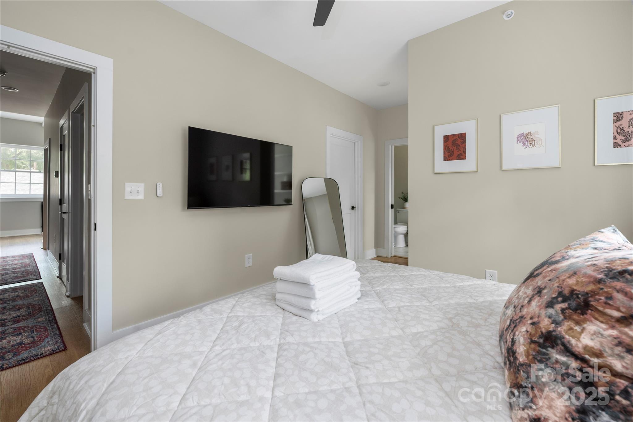 203 Grandin Road, Unit 3 Charlotte, NC 28208 - Photo 17 of 34 a bedroom with a bed and a mirror