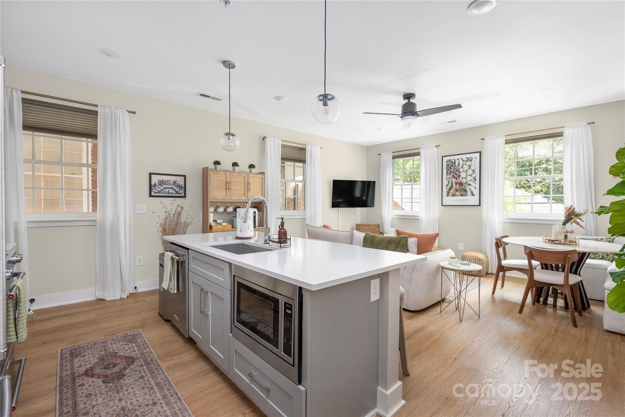 203 Grandin Road, Unit 3 Charlotte, NC 28208 - Photo 2 of 34 a view of kitchen island a sink and living room