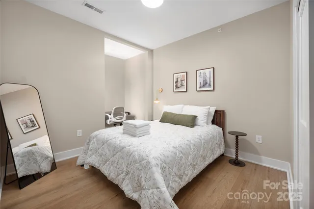 a bedroom with bed and window