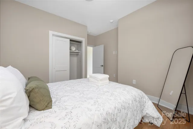 a large bed in a white room