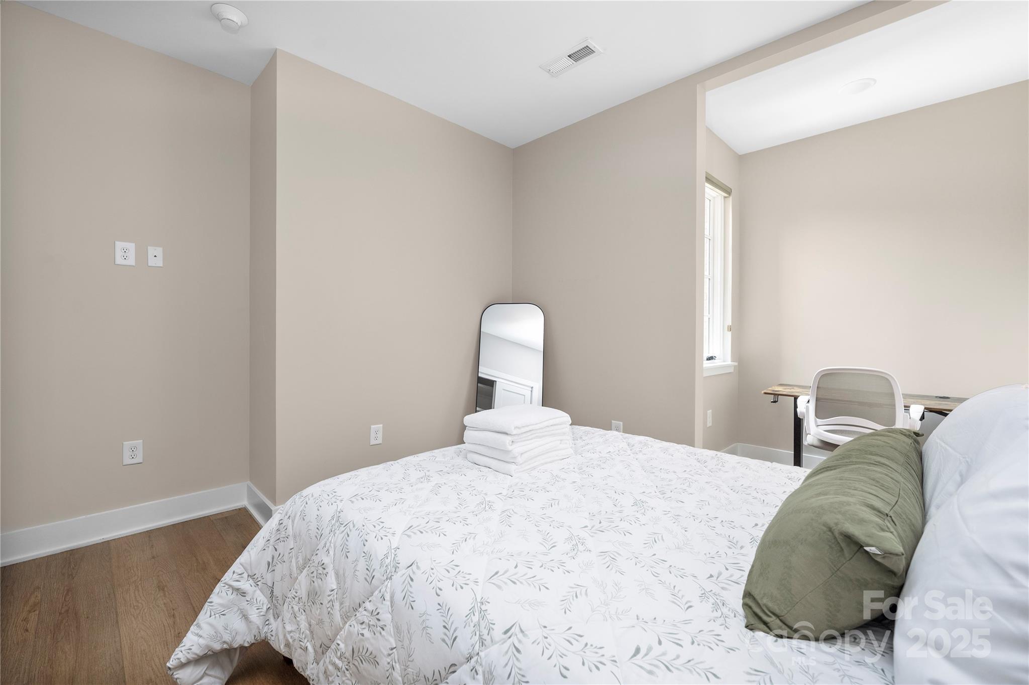 203 Grandin Road, Unit 3 Charlotte, NC 28208 - Photo 24 of 34 a bedroom with a bed and a lamp