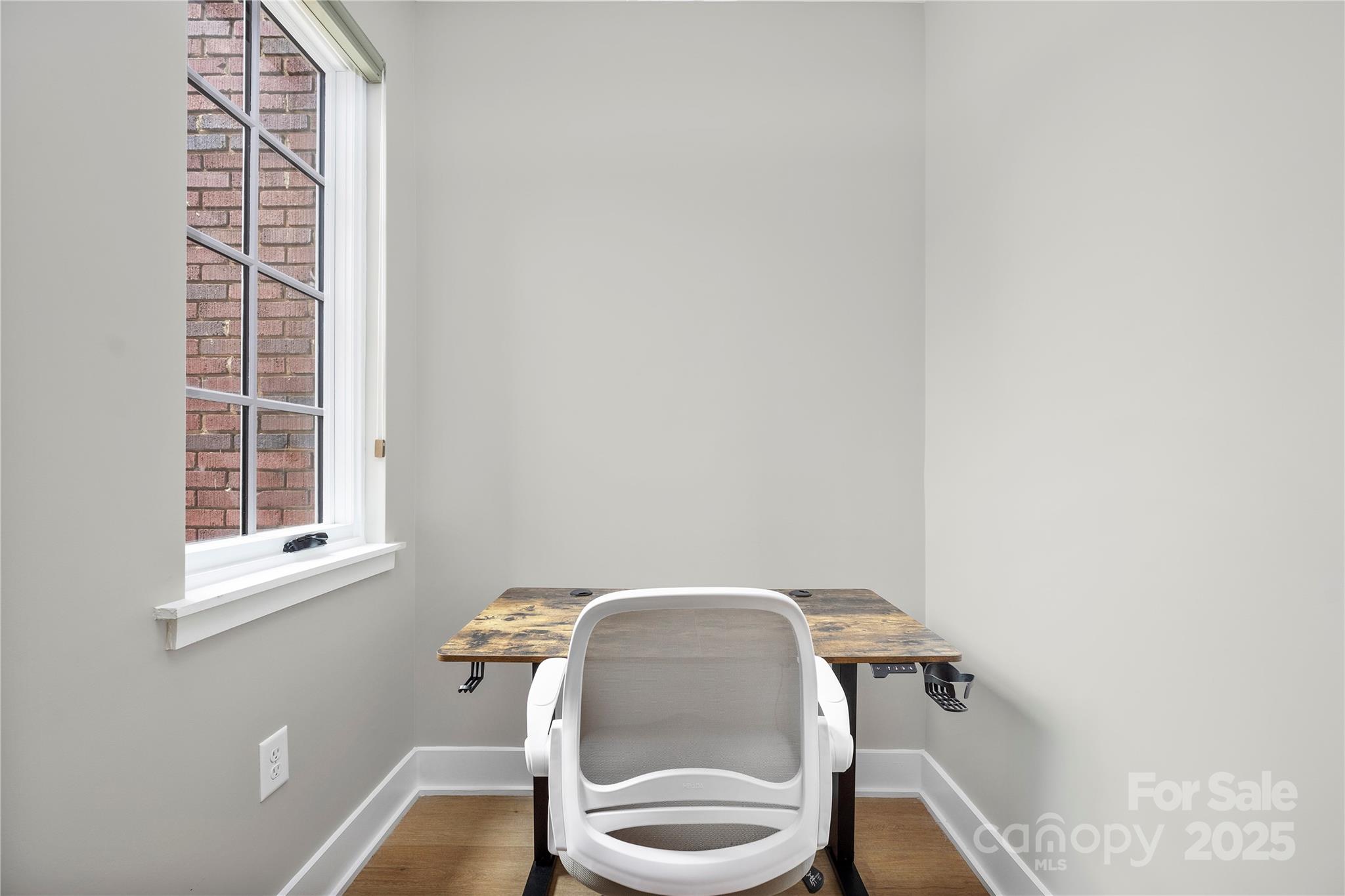203 Grandin Road, Unit 3 Charlotte, NC 28208 - Photo 25 of 34 a chair and a table in a room