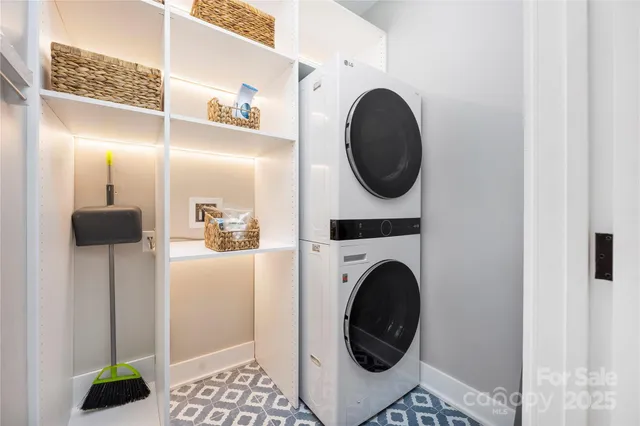 a view of a hallway with washer and dryer