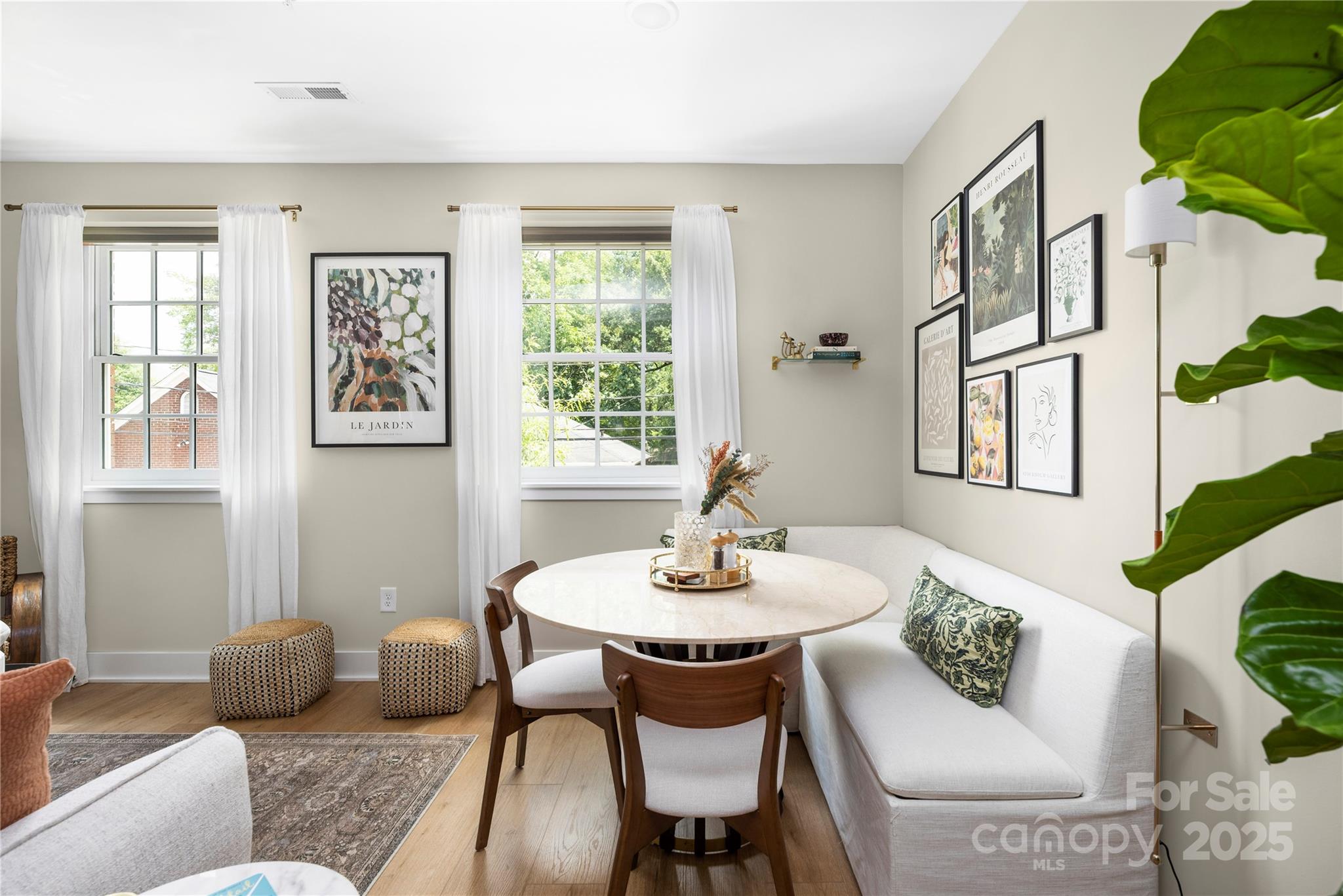 203 Grandin Road, Unit 3 Charlotte, NC 28208 - Photo 3 of 34 a dining room with furniture and window