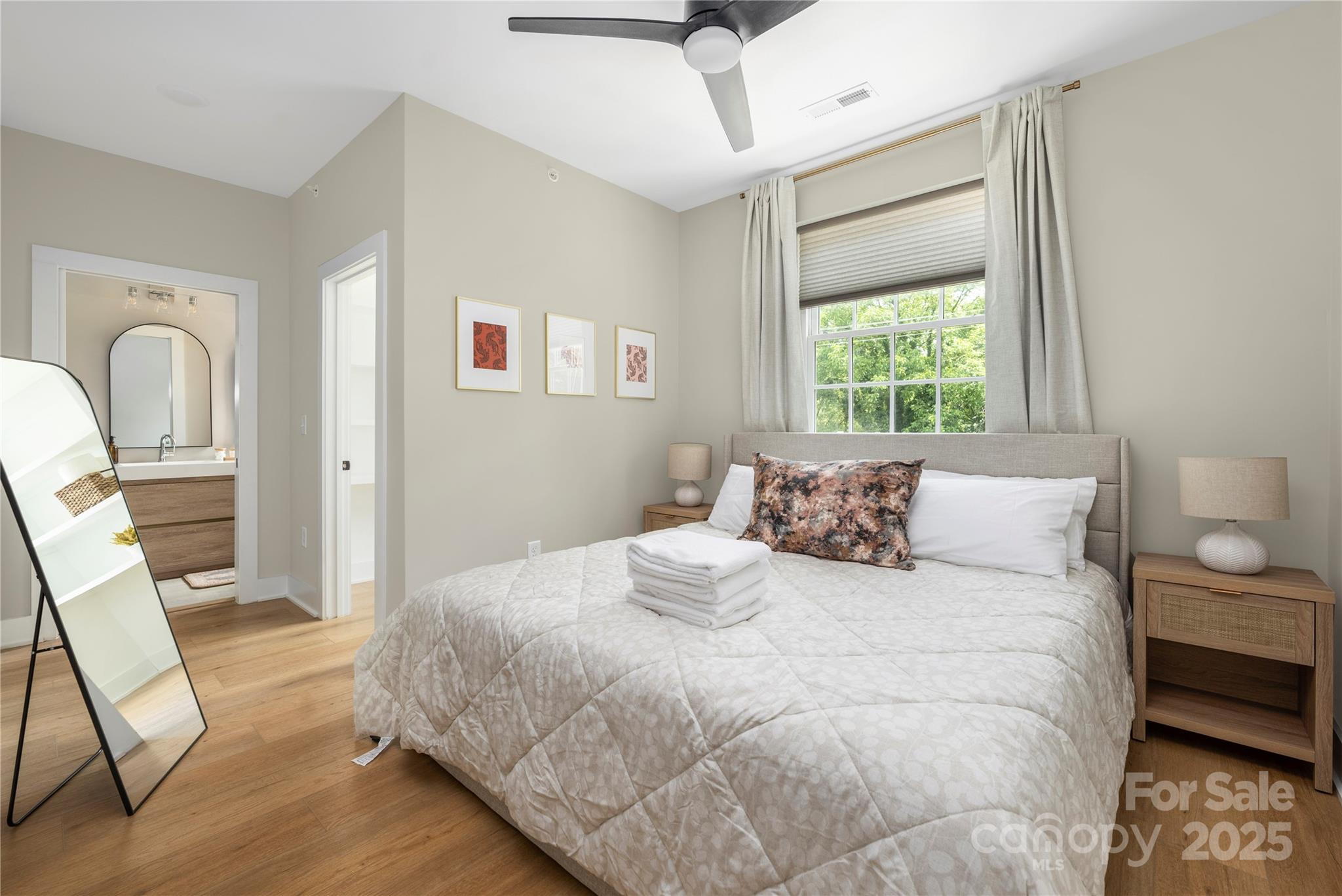 203 Grandin Road, Unit 3 Charlotte, NC 28208 - Photo 4 of 34 a large white bed in a white room