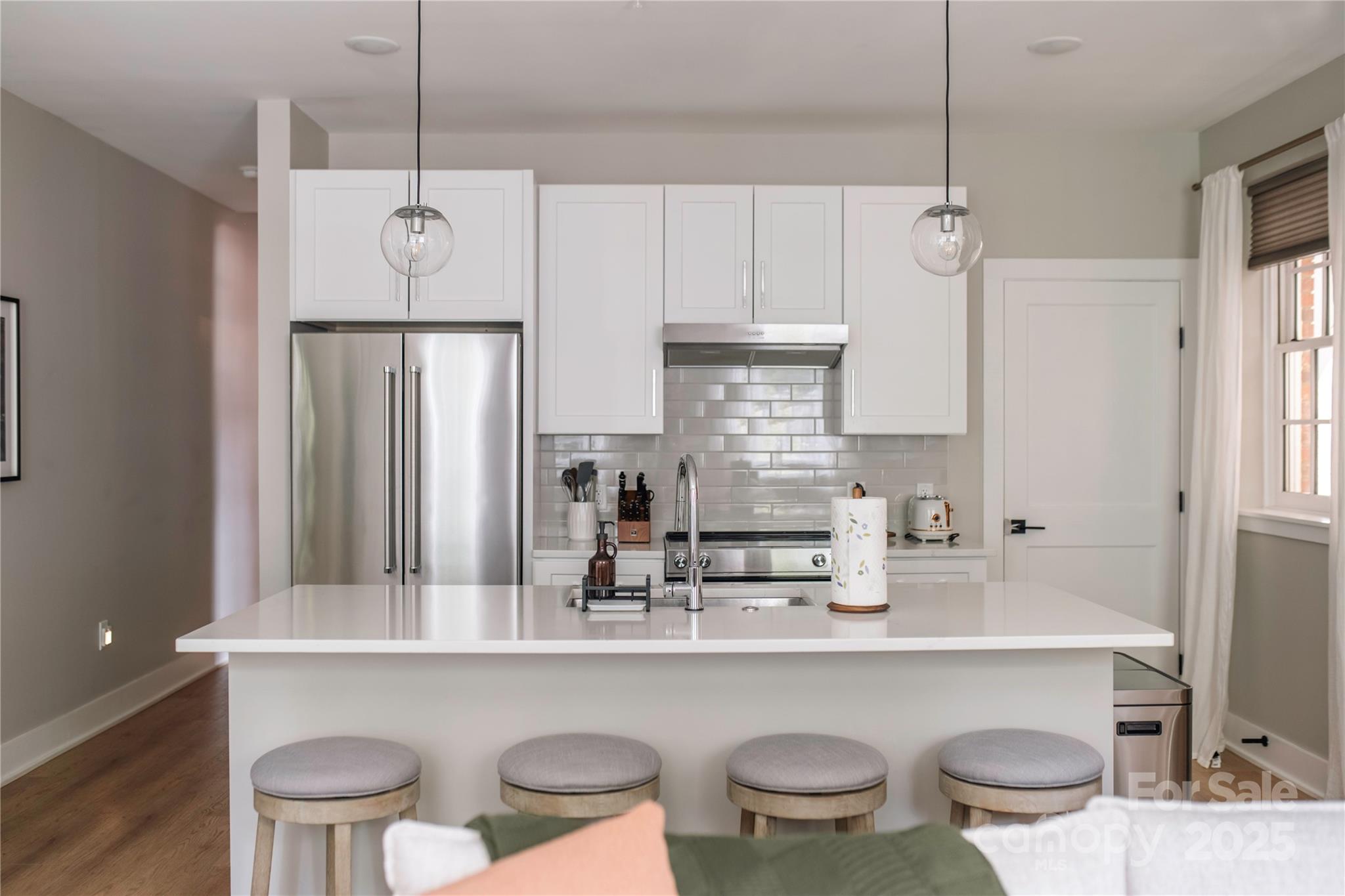 203 Grandin Road, Unit 3 Charlotte, NC 28208 - Photo 8 of 34 a kitchen with a table and chairs in it