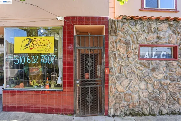 front view of a building with a door and a window