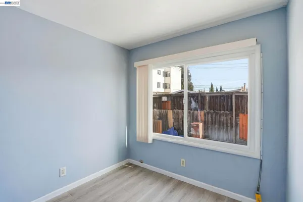 a view of an empty room with a window