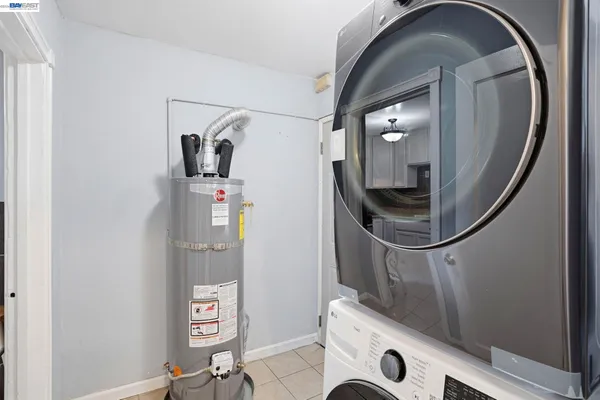a view of storage and utility room with washer and dryer