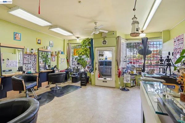a view of a livingroom with furniture and a window