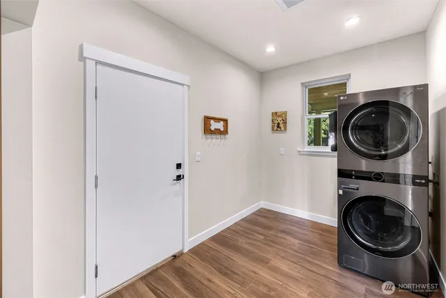 a view of a hallway with washer and dryer