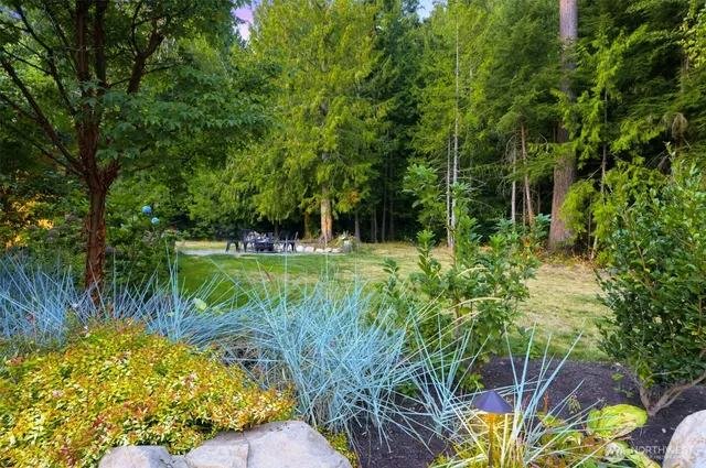 a view of a backyard with sitting area