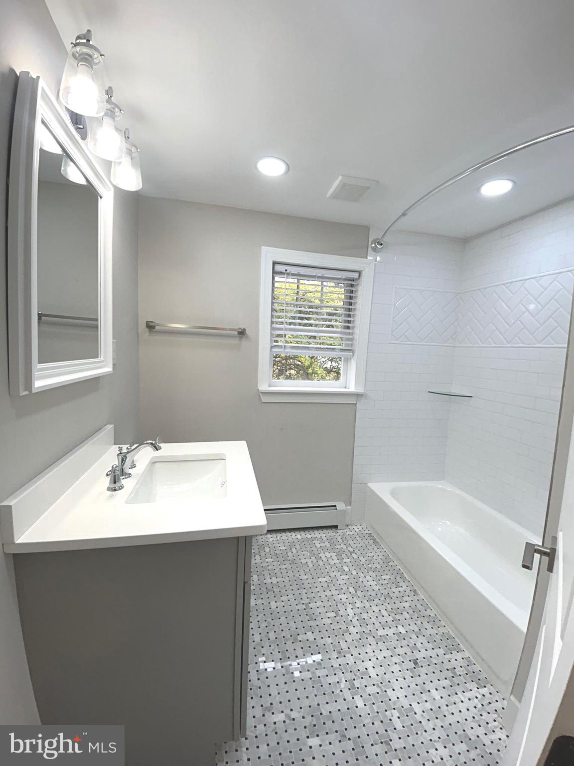 381 Upper Gulph Road Wayne, PA 19087 - Photo 12 of 17 a bathroom with a sink a toilet and shower