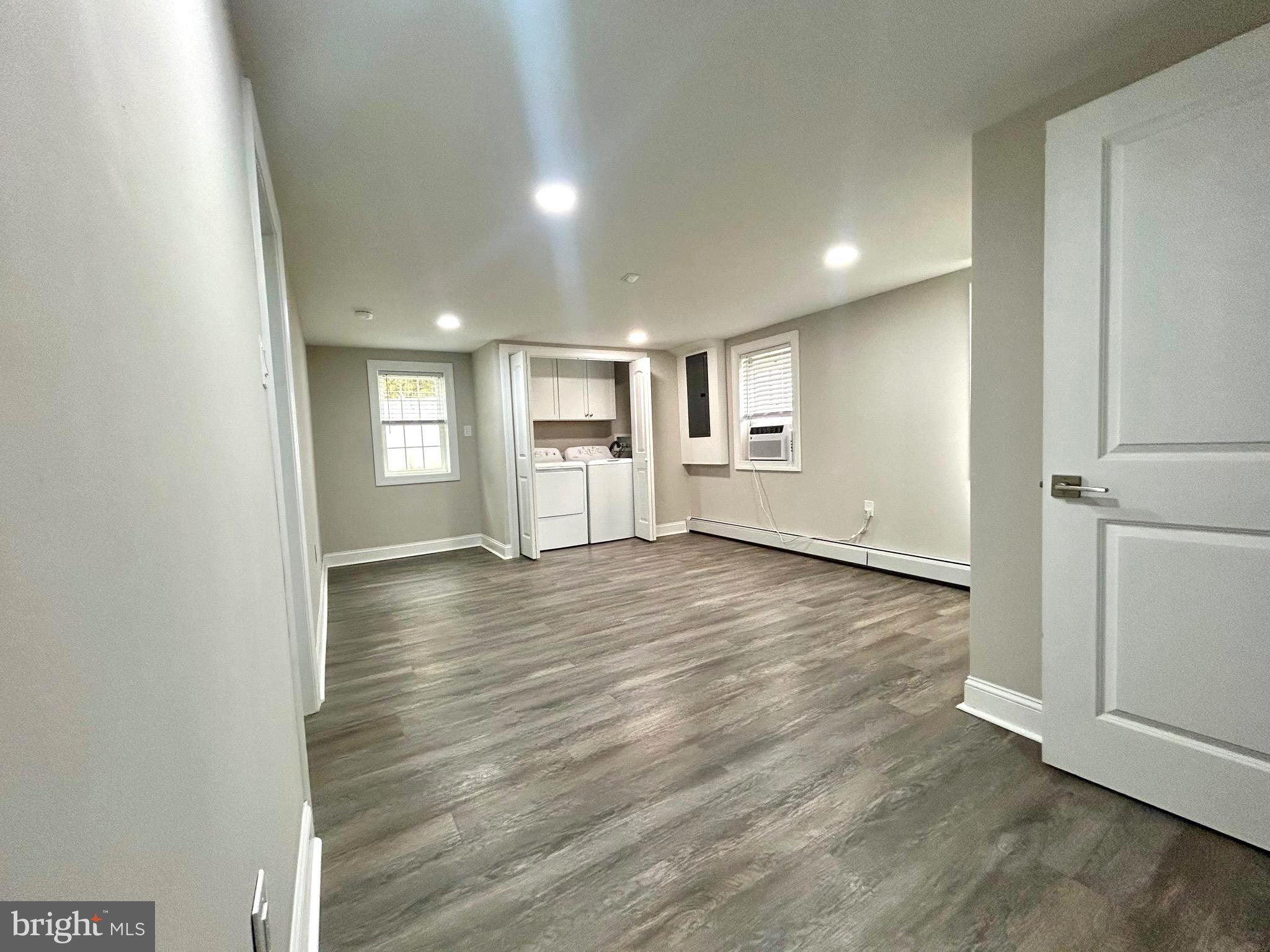 381 Upper Gulph Road Wayne, PA 19087 - Photo 13 of 17 an empty room with wooden floor and windows